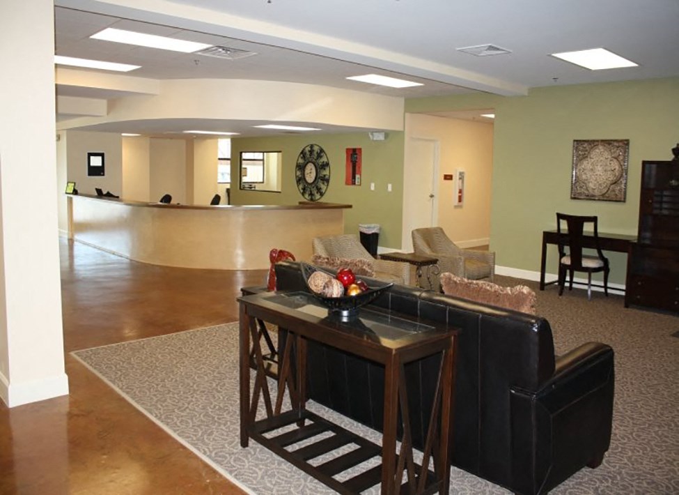 a living room with a couch and a table