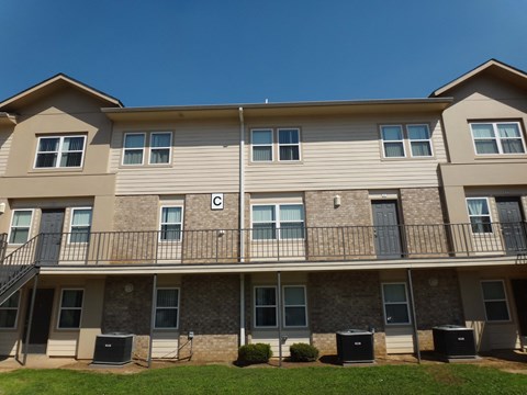 Apartment building with a clear blue sky in the background.