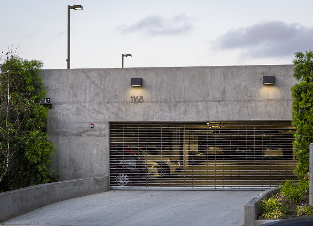 a building with a gate and a parking lot