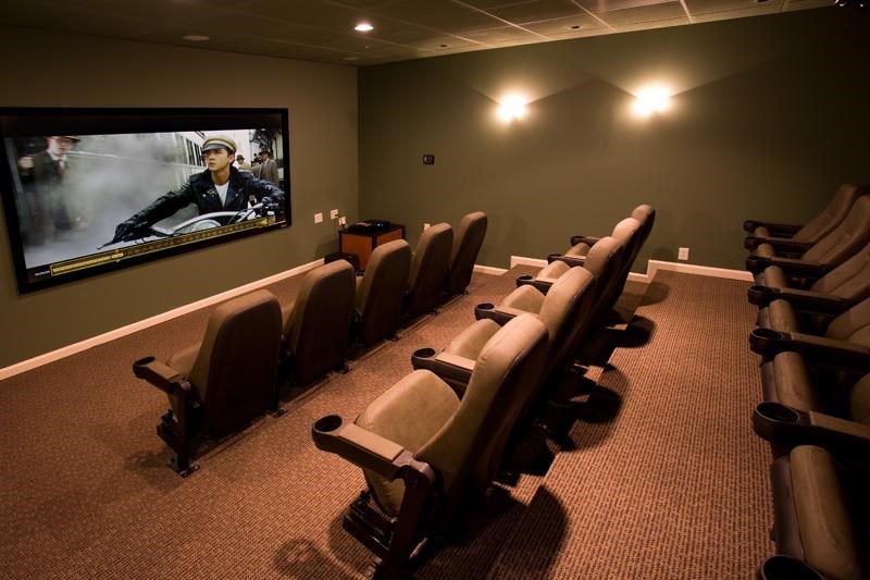 a large room with chairs and a tv in it