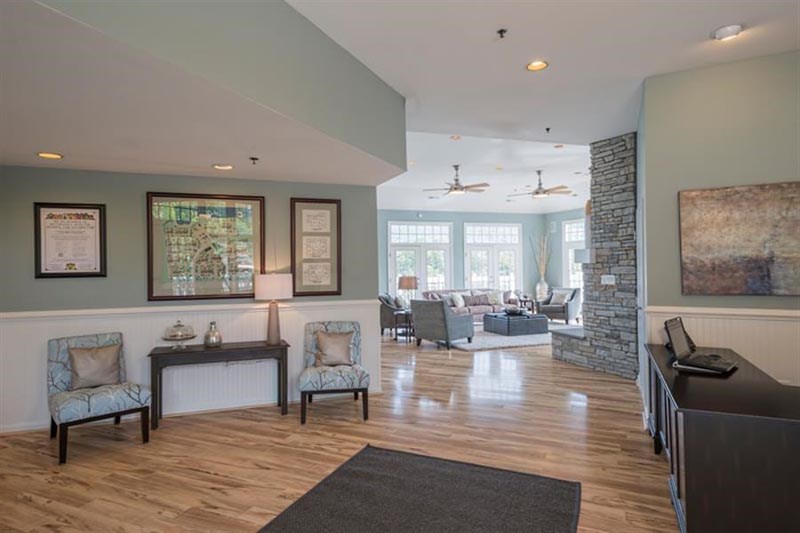 a living room with a fireplace and a wood floor