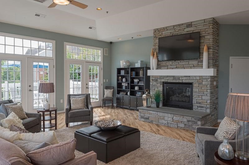 a living room with a fireplace and a television