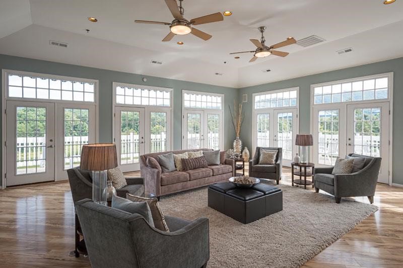 a living room with couches and chairs