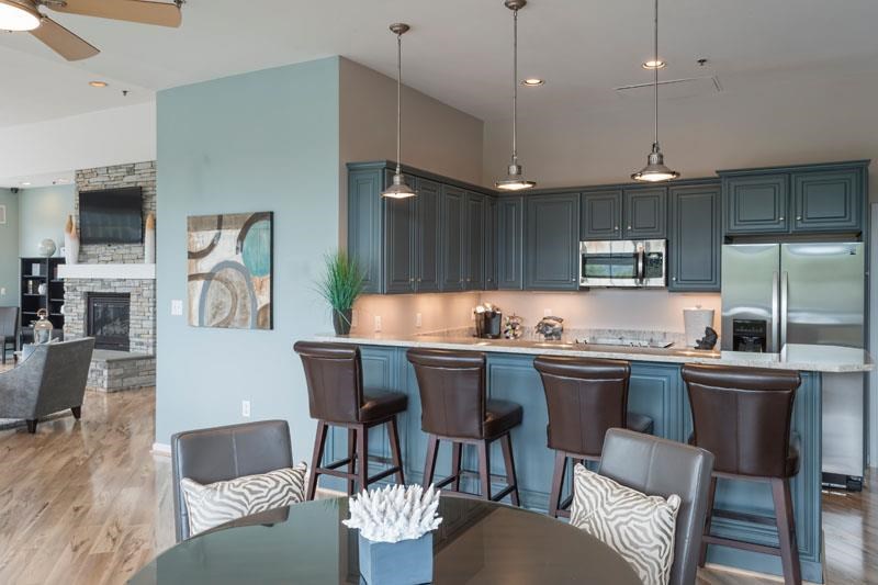 a kitchen and dining room with a table and chairs