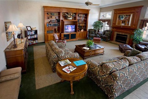 a living room with couches and a table