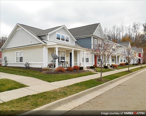 a row of houses on the side of a street