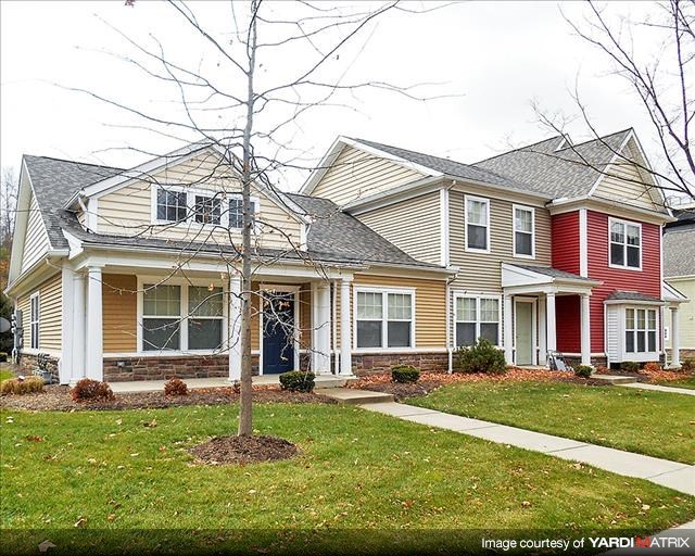 a house with a tree in the front of it