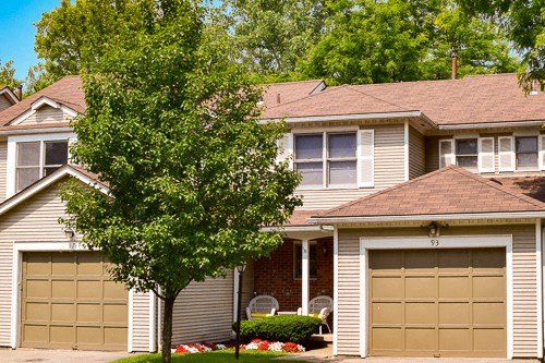 a house with a tree in front of it