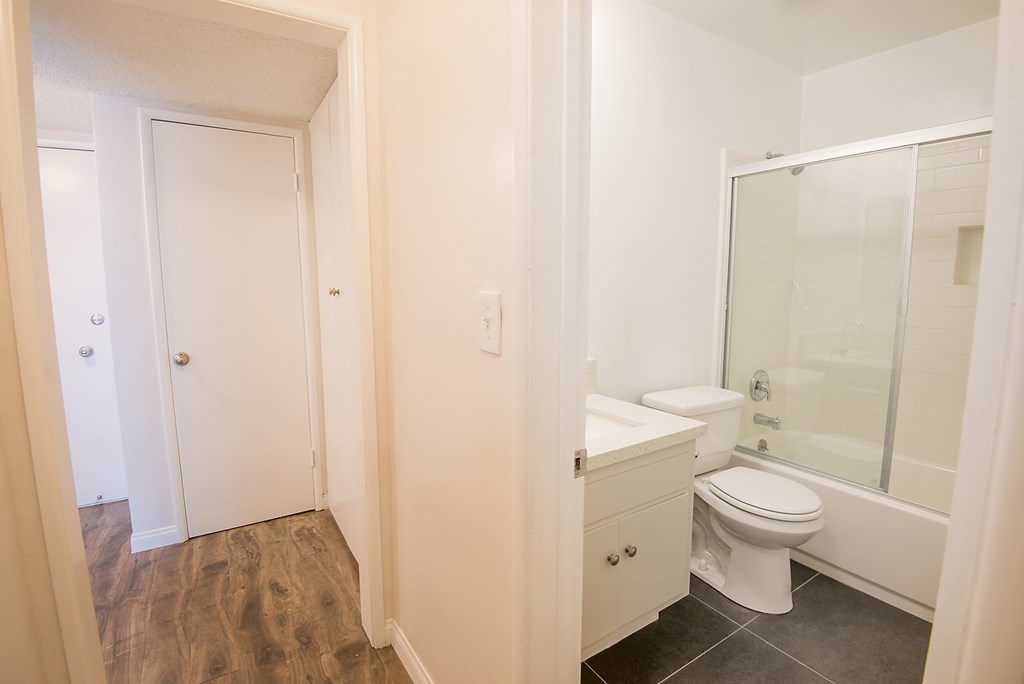 a small bathroom with a toilet and a shower