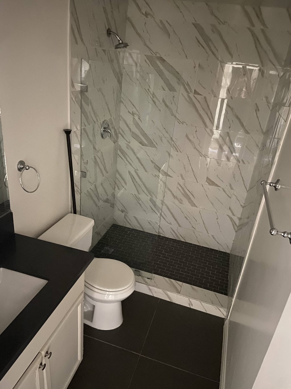 a small bathroom with a shower and a toilet