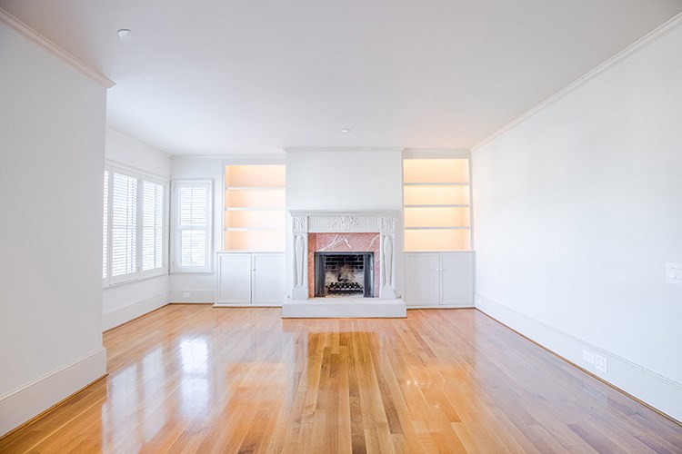 the living room of a house with a fireplace