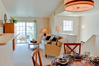 Dining and living area at Prairie Point Apartments in Merrillville, IN - Photo Gallery 2