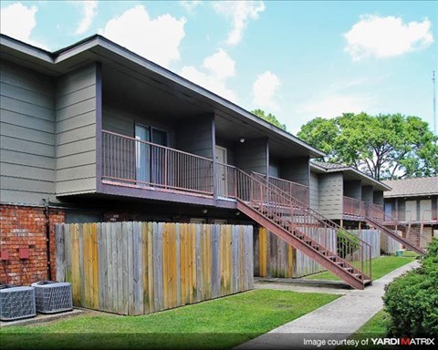 a house with a deck and a fence
