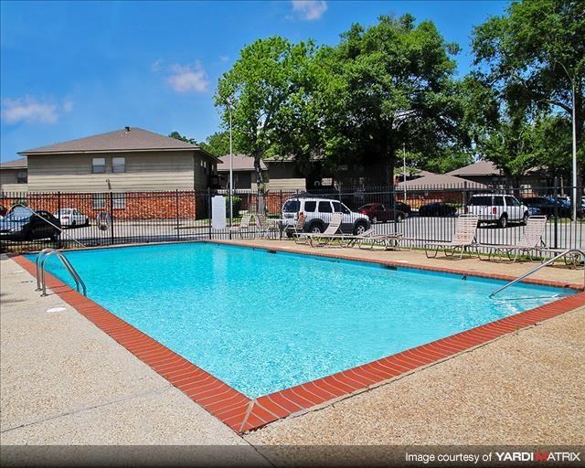 a swimming pool with a fence around it