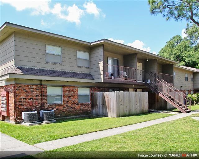 a house with a yard and a staircase