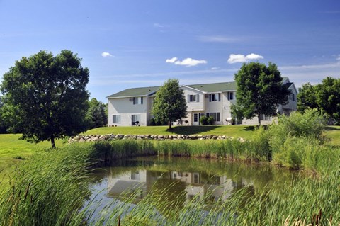 a large pond in front of a house