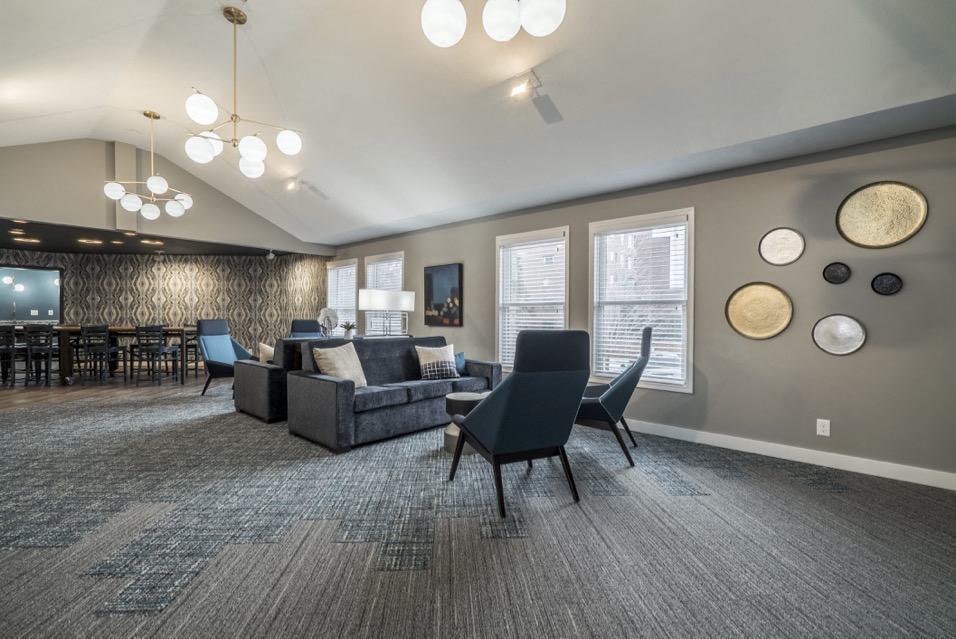 Community room with sofa and conversational seating