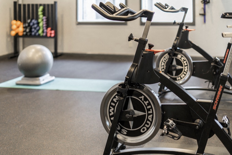 Yoga studio with cycling machines and an exercise room