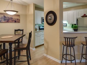 Plank-style flooring in kitchen and dining room