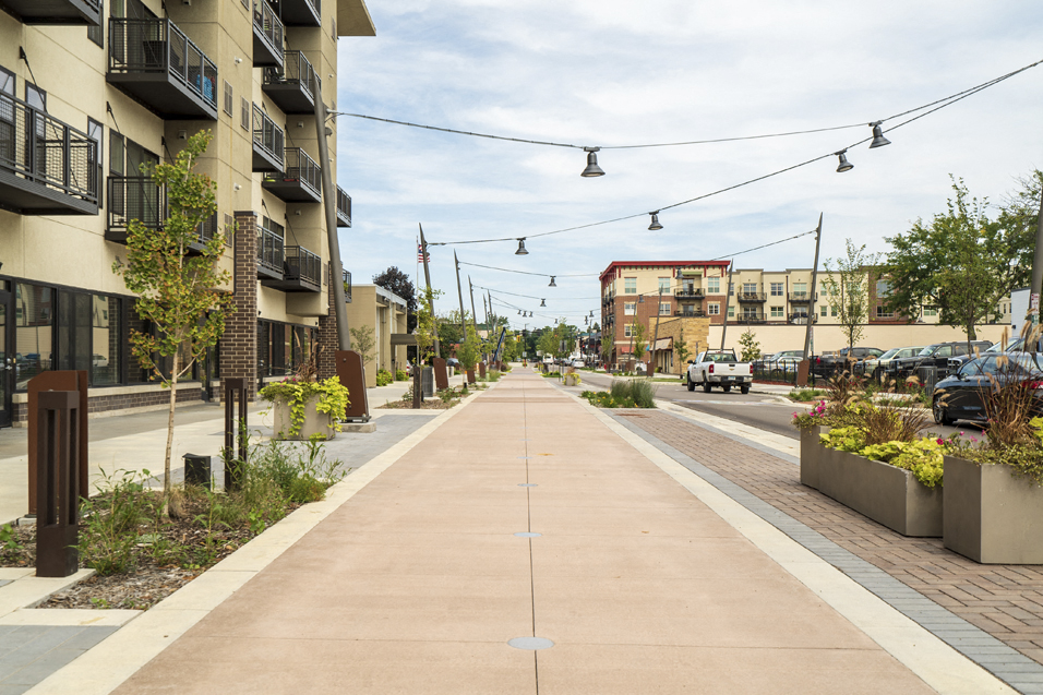 city street with lights hanging overhead