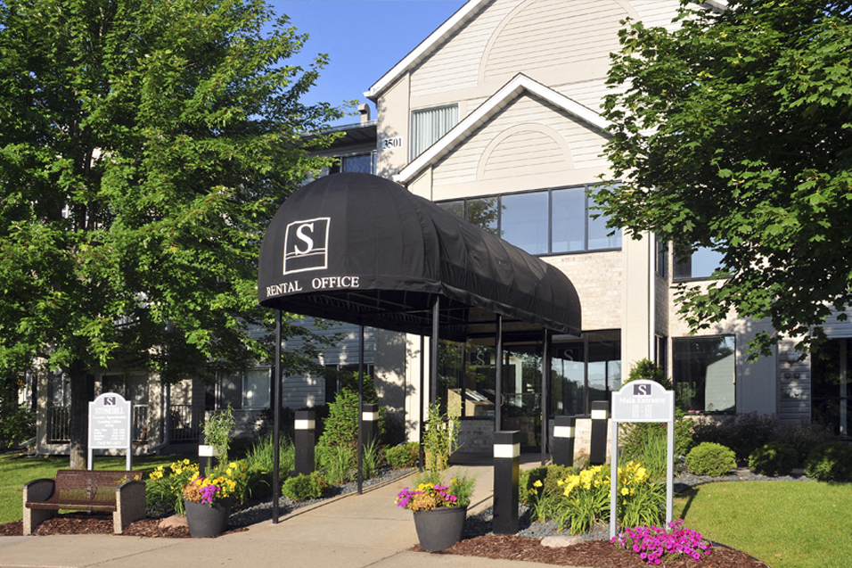 Awning over entrance that reads "Leasing Office"