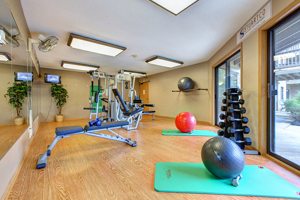 fitness room with exercise balls, yoga mat, and exercise equipment