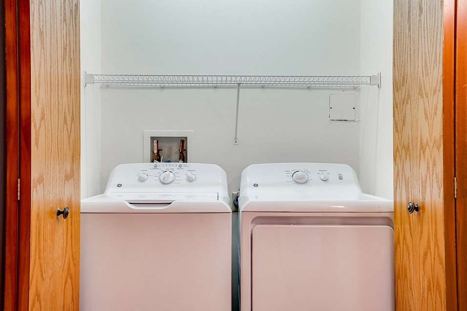 Washer and dryer behind collapsing closet doors