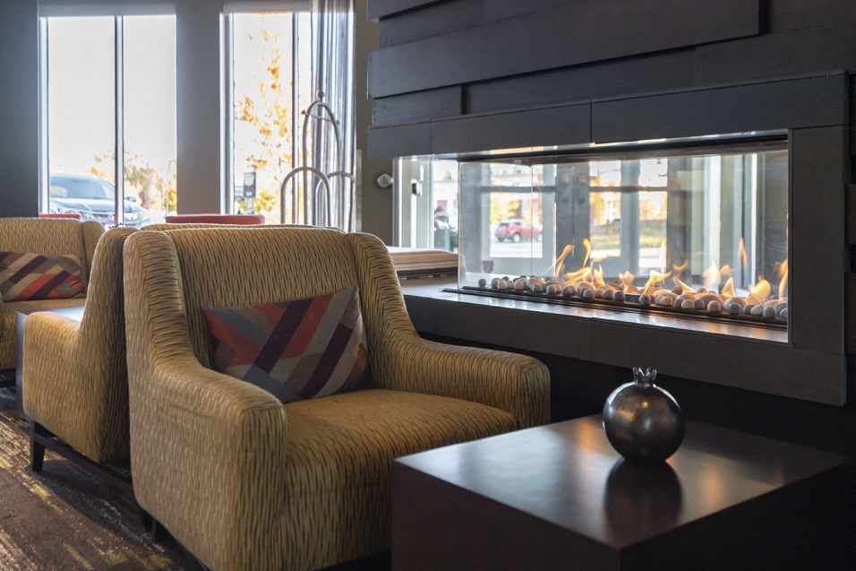 Chair next to gas fireplace