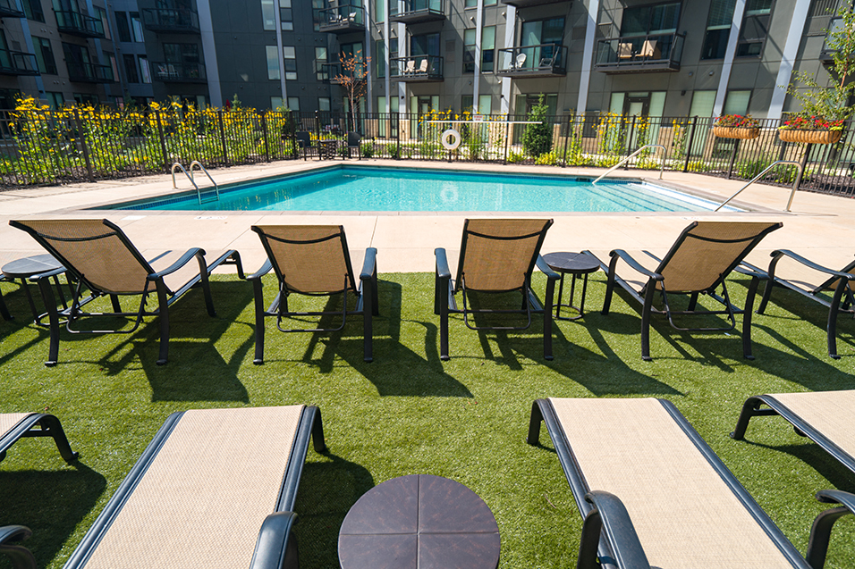 Outdoor lounge seating overlooking pool