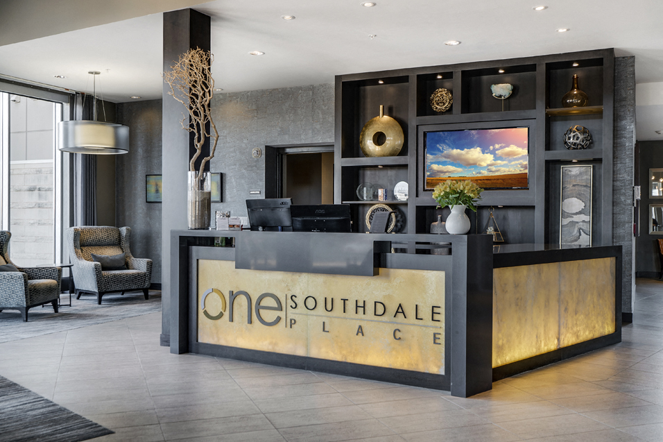 Concierge desk with the words "One Southdale Place" written on it