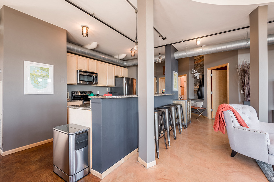 kitchen and living room separated from breakfast bar