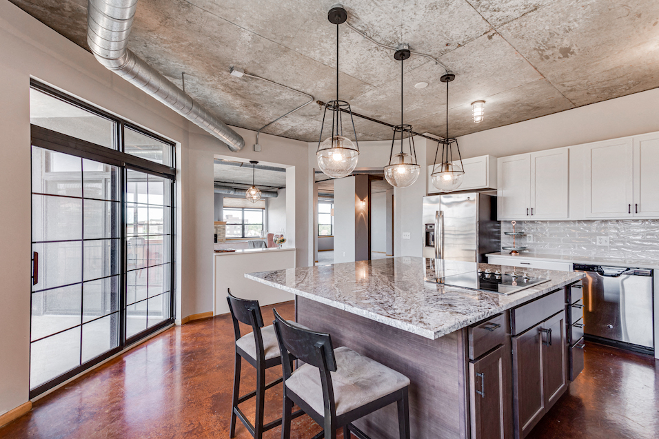 Kitchen with island seating and granite countertops