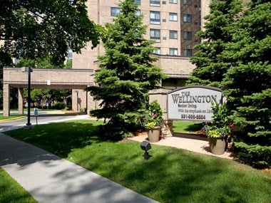 Outside of property with view of "The Willington" property sign