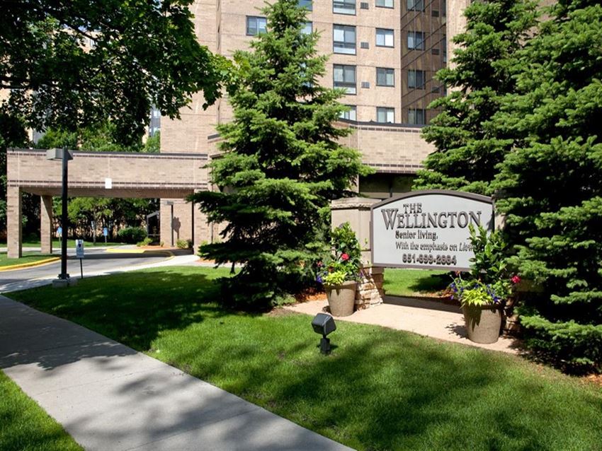 Outside of property with view of "The Willington" property sign