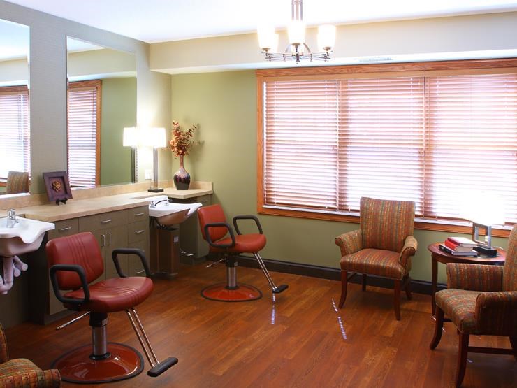 a doctors office with chairs and a table