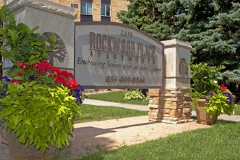 Property sign that reads "Rockwood Place Apartments" and then a phone number - Photo Gallery 16