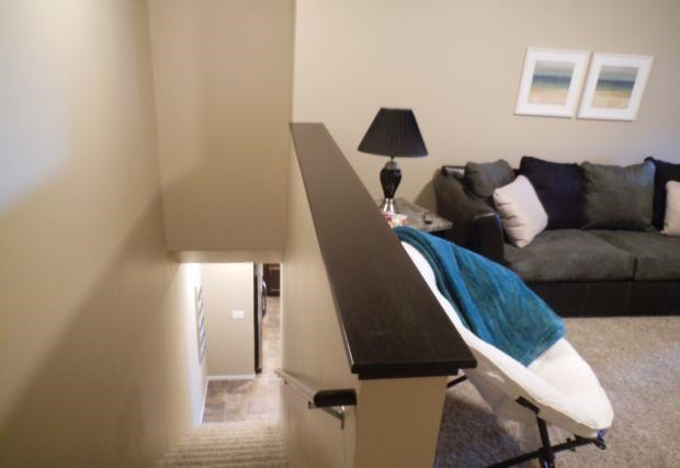 a living room with a couch and a bar in the middle