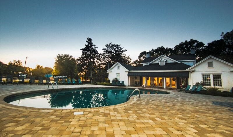 a swimming pool and a house with a pool