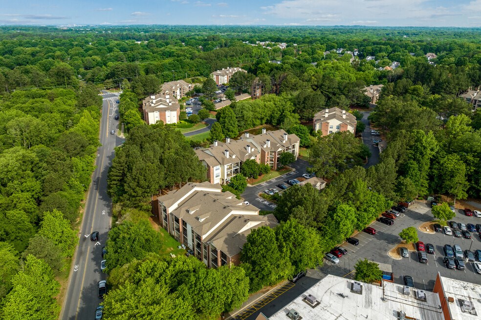 an aerial view of a city with buildings and trees