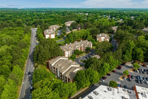 an aerial view of a city with buildings and trees