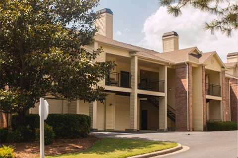 an apartment building with a stop sign in front of it