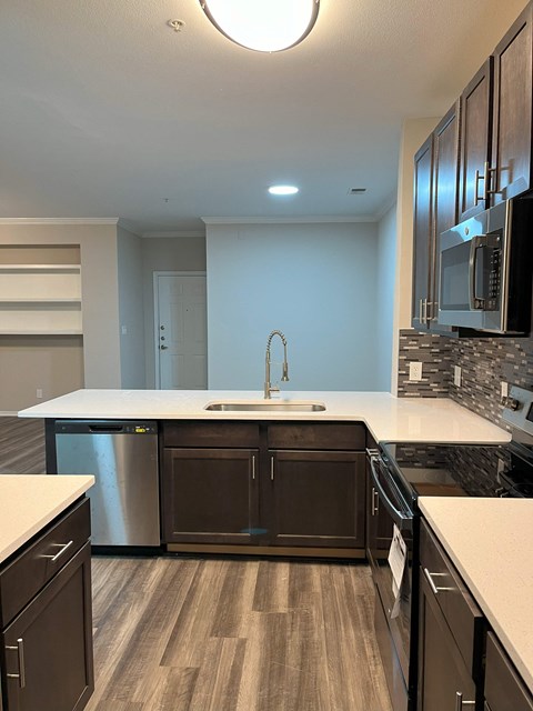 a kitchen with a sink and a counter top