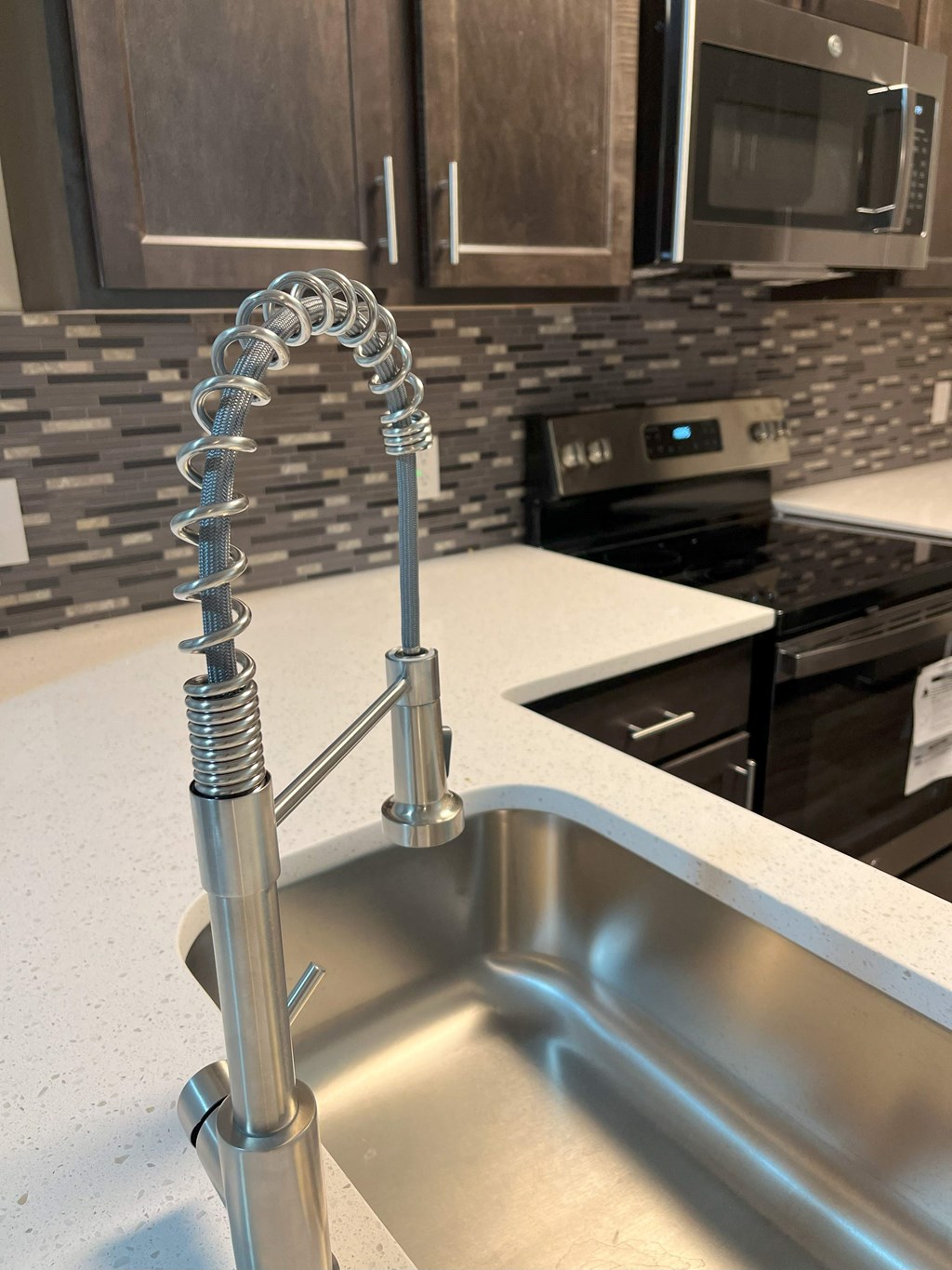 a kitchen with a faucet over a sink