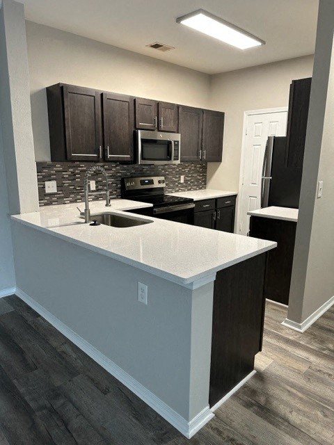 a kitchen with a counter top and a sink