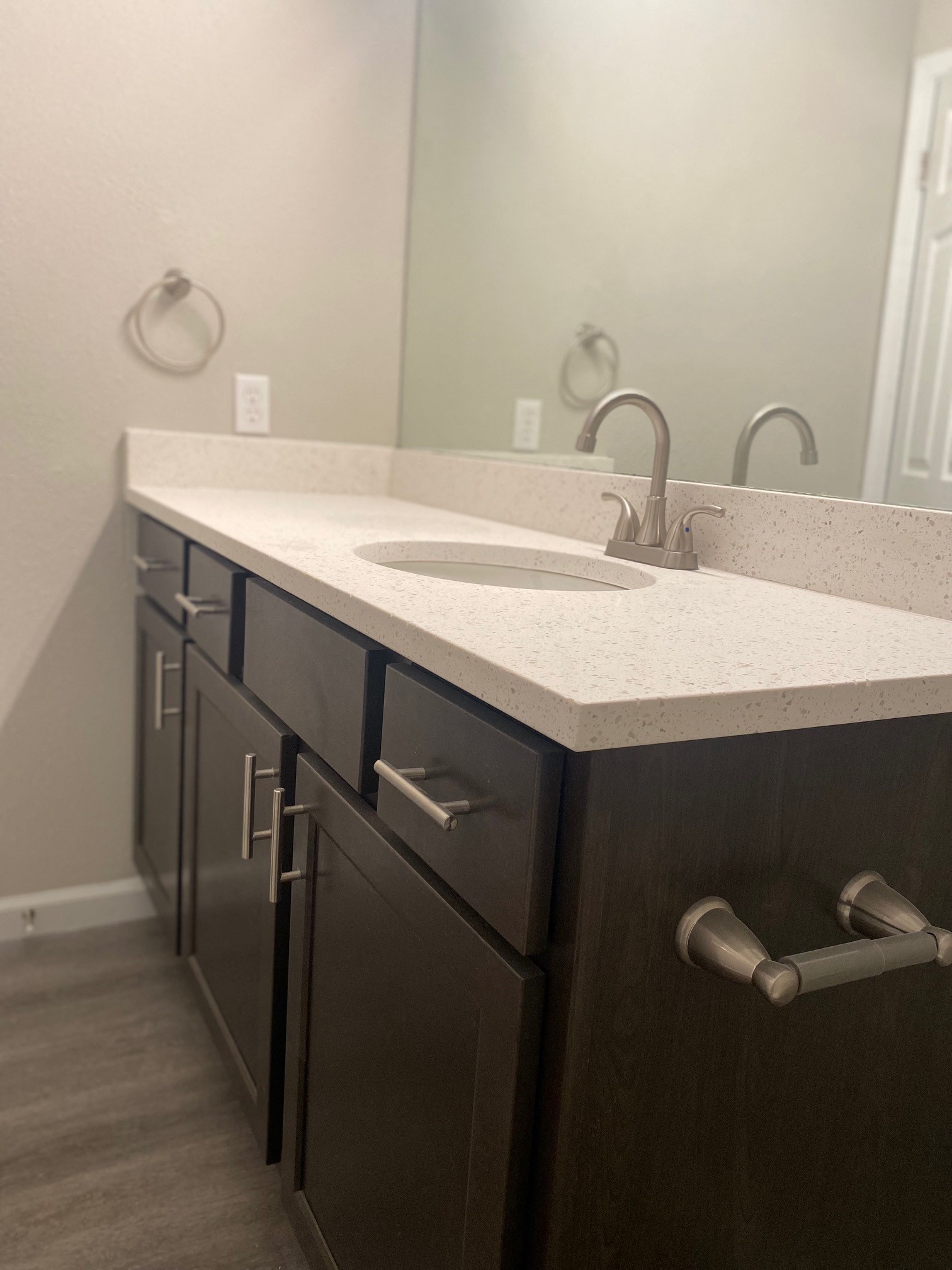 an empty bathroom with a sink and a mirror