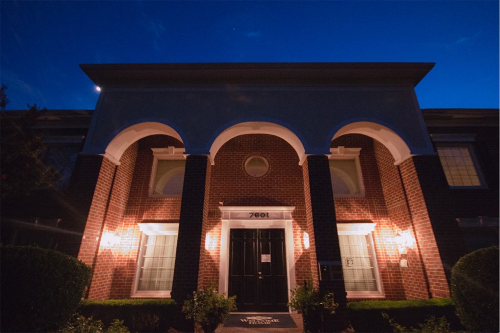 the courthouse at night with the blue sky in the background