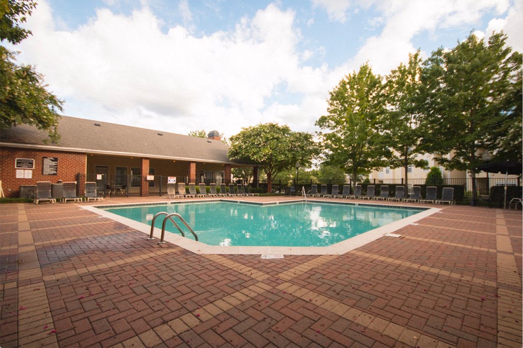 a swimming pool in front of a building