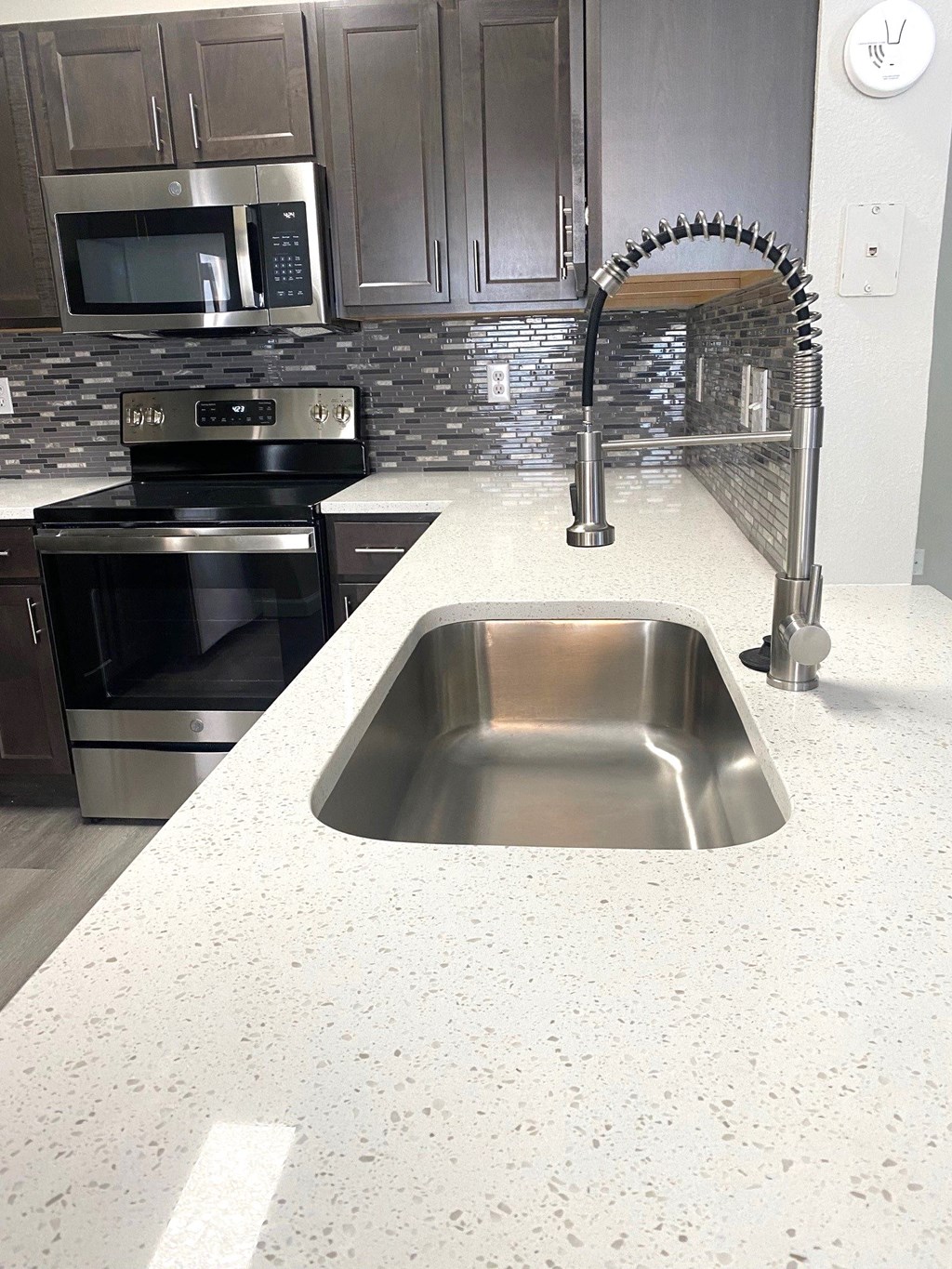 a kitchen with stainless steel appliances and a sink