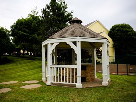 a gazebo in the middle of a yard