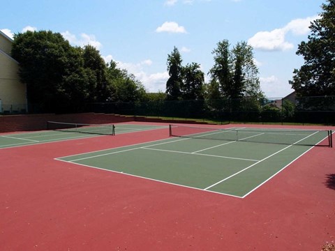 a tennis court on a red and green court